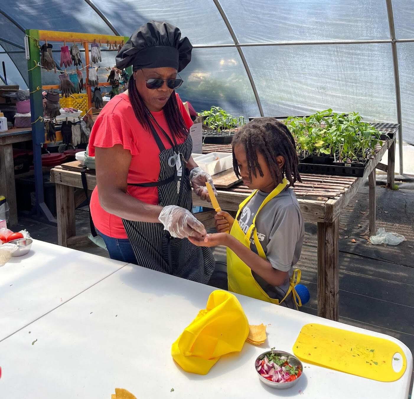 Chef Bev teaching her granddaughter how to cook
